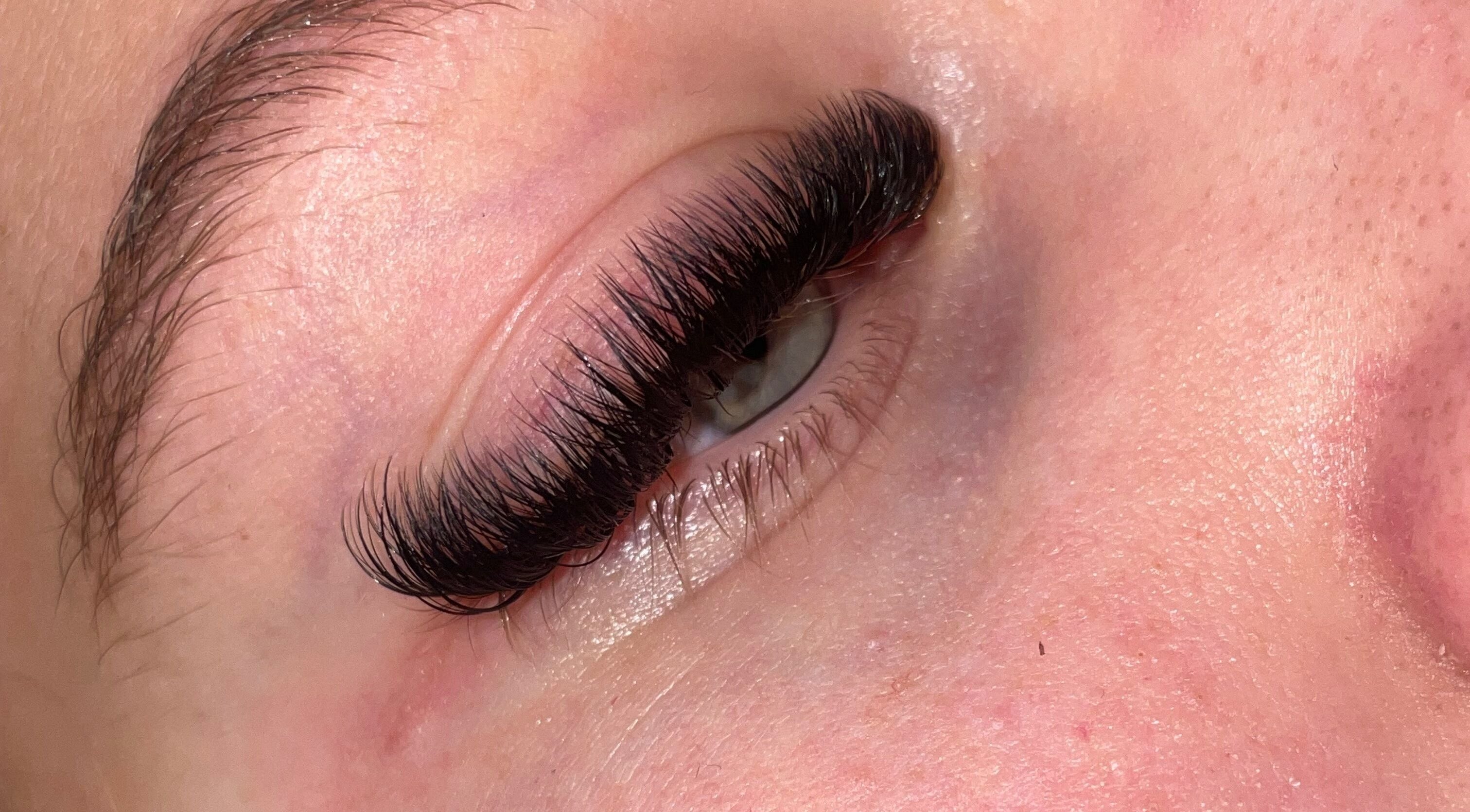 Close-up of expertly applied eyelash extensions at What the Fluff Lash Artistry, Chelmsford, England, GB.