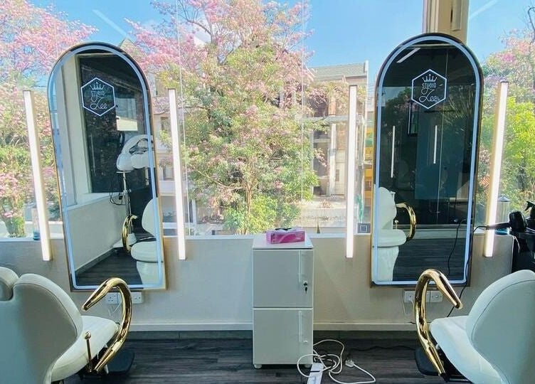 Stylish salon interior at Studio Zee | Colombo 07 with elegant mirrors and plush chairs in Colombo, Western Province, LK.