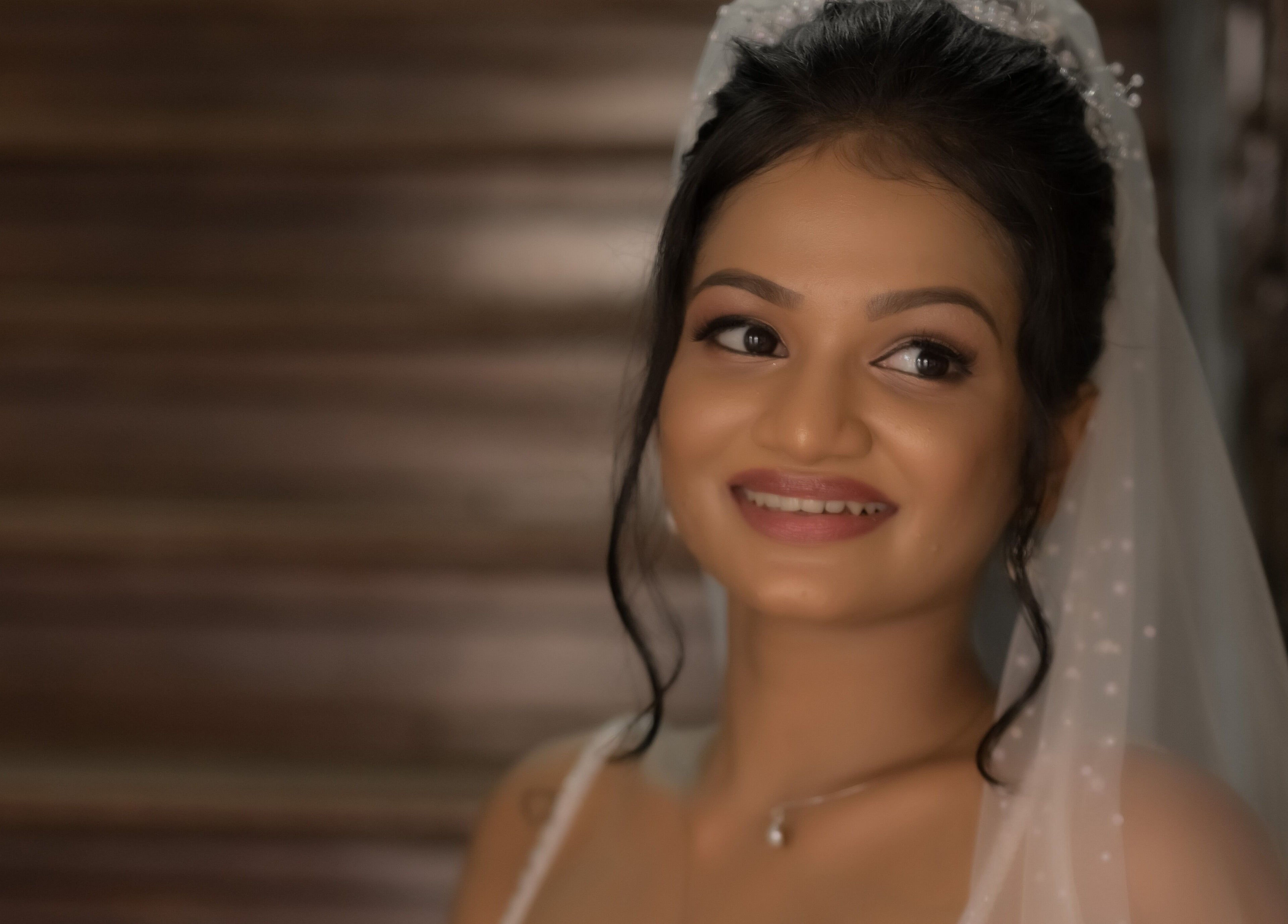 Bride smiling in elegant bridal wear at Studio Zee | Colombo 07, Colombo, Western Province, LK.