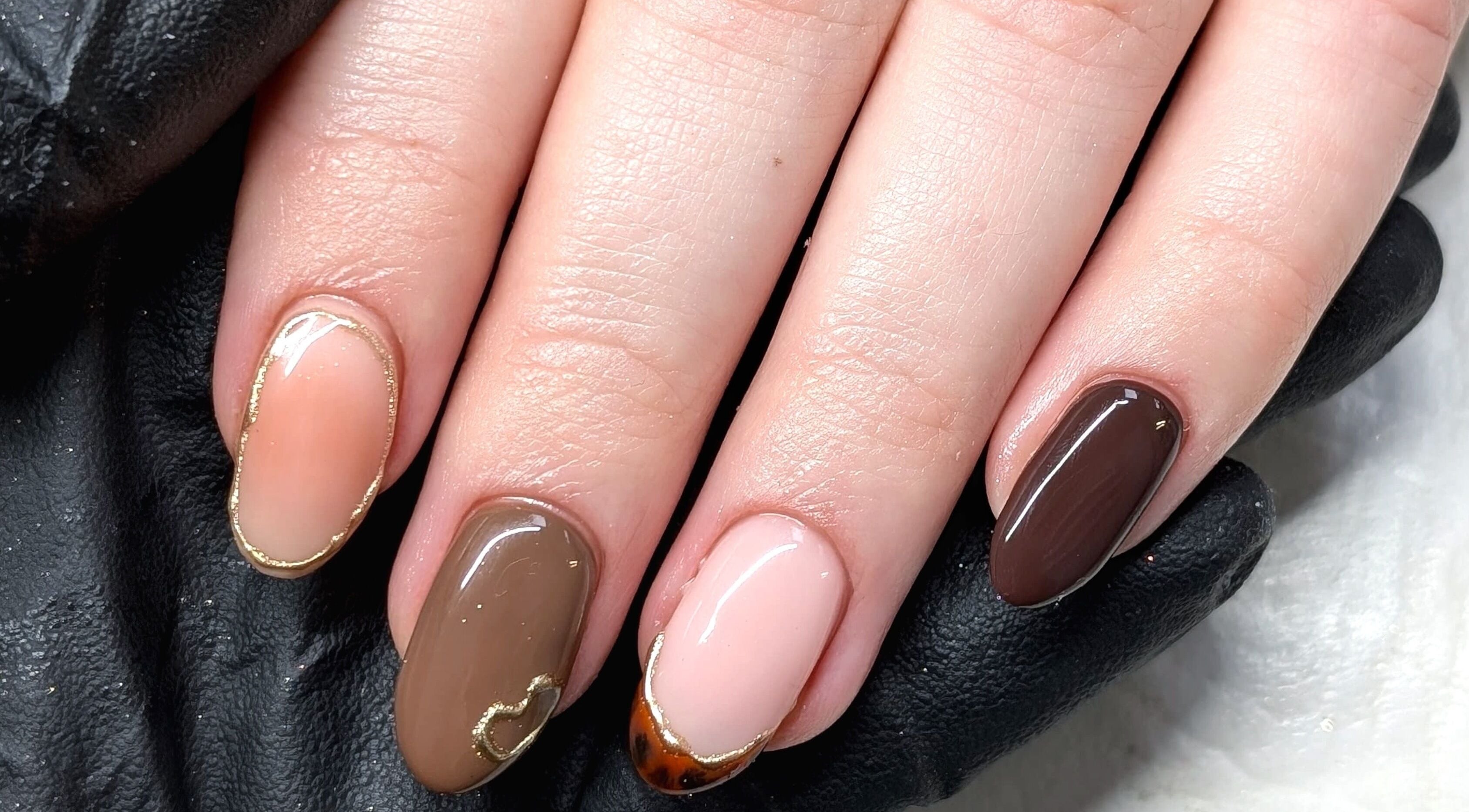Beautiful nail art at Chloe Hartfield Nail Tech, Burgess Hill, England, GB, showcasing detailed brown designs.
