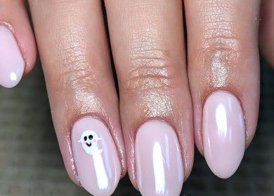 Chloe Hartfield Nail Tech in Burgess Hill, England, GB showcases elegant pink nails with cute ghost nail art.