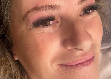 Close-up of a woman with expertly applied eyelashes at Envious Effects Cosmetic Tattoo - Southport, Queensland, AU.