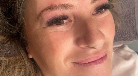 Close-up of a woman with expertly applied eyelashes at Envious Effects Cosmetic Tattoo - Southport, Queensland, AU.