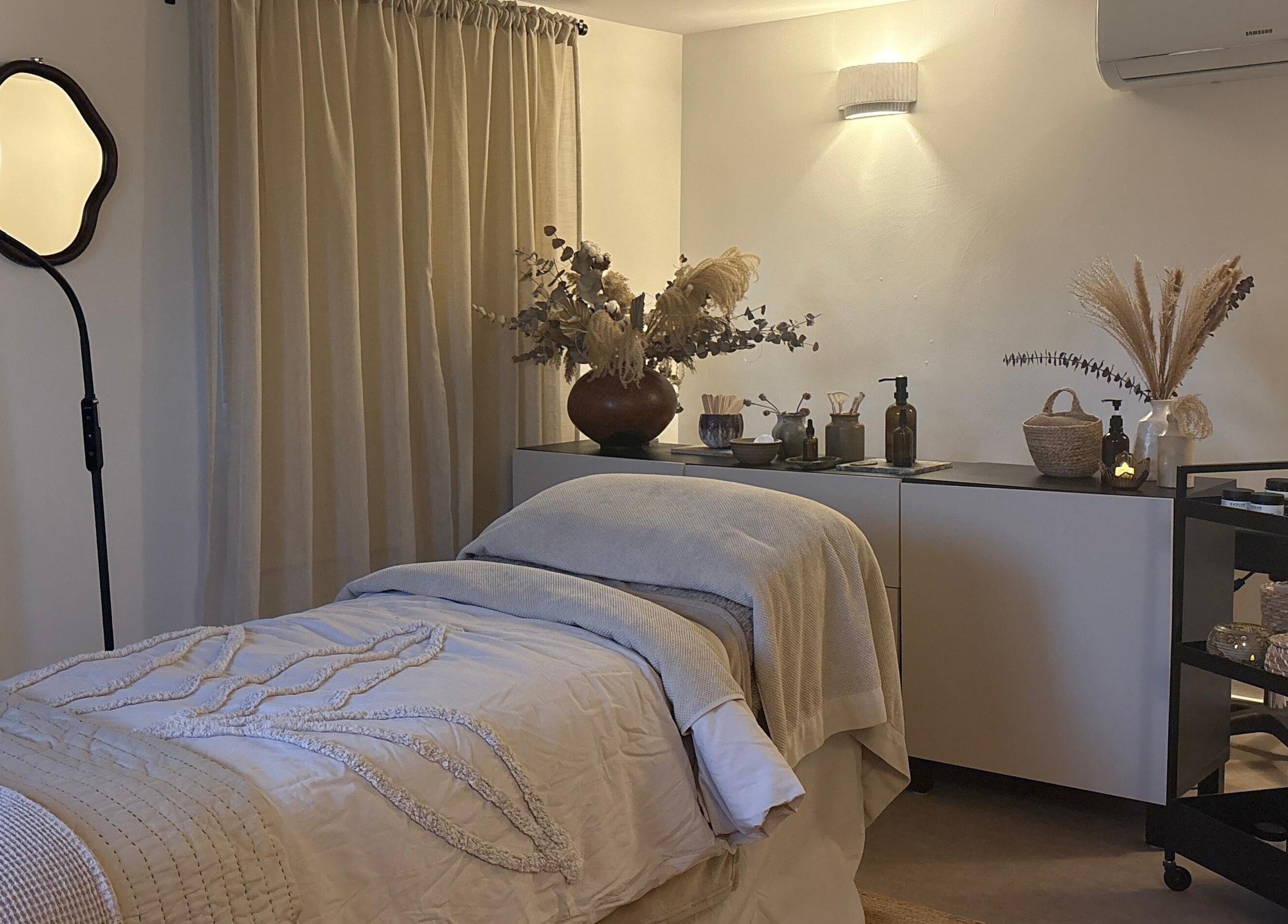 Relaxing treatment room at Mon Remède Beauty, Bristol, England, GB, showcasing serene decor and cozy ambiance.