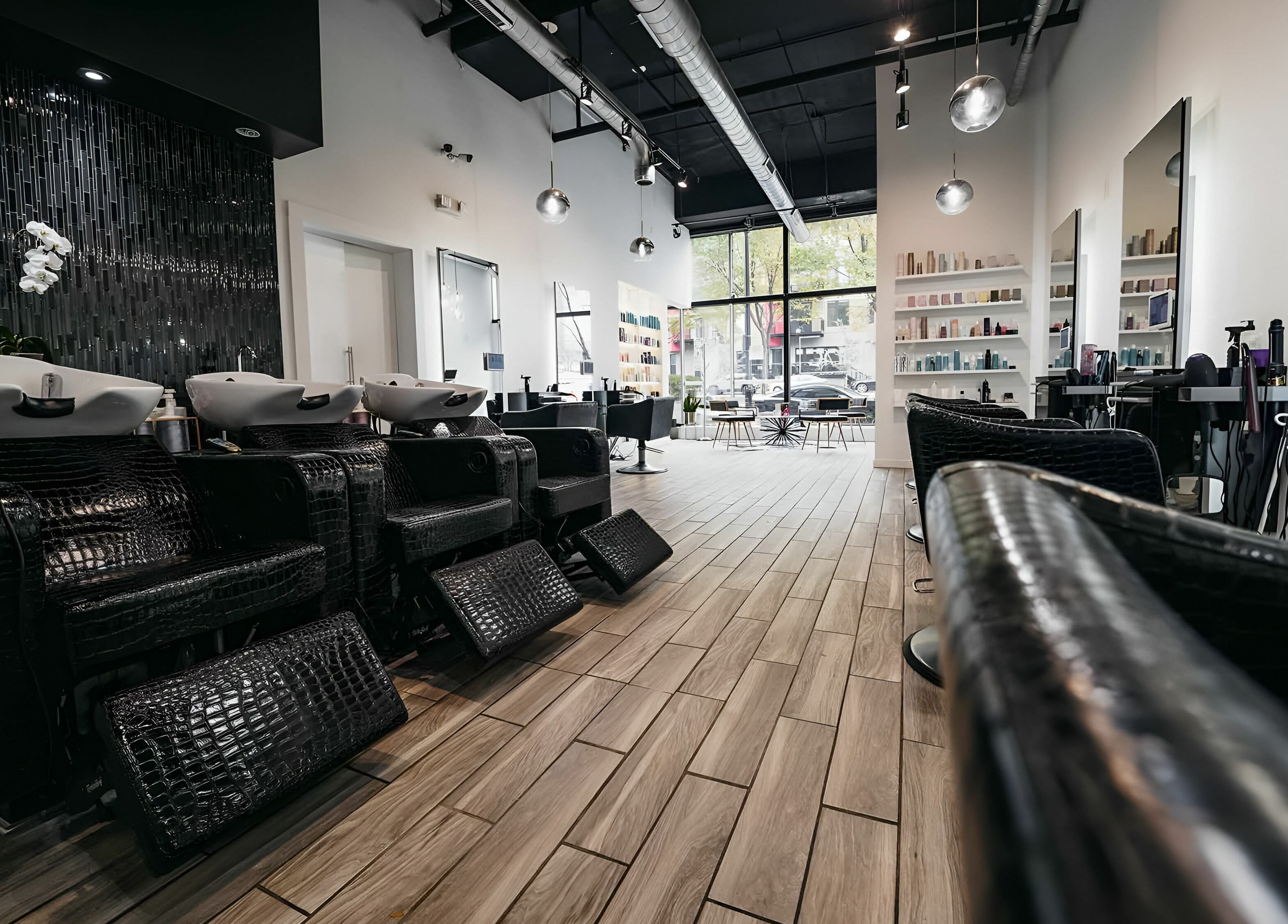 Modern interior of Salon Blānc in Milwaukee, Wisconsin, US with stylish washbasins and seating.
