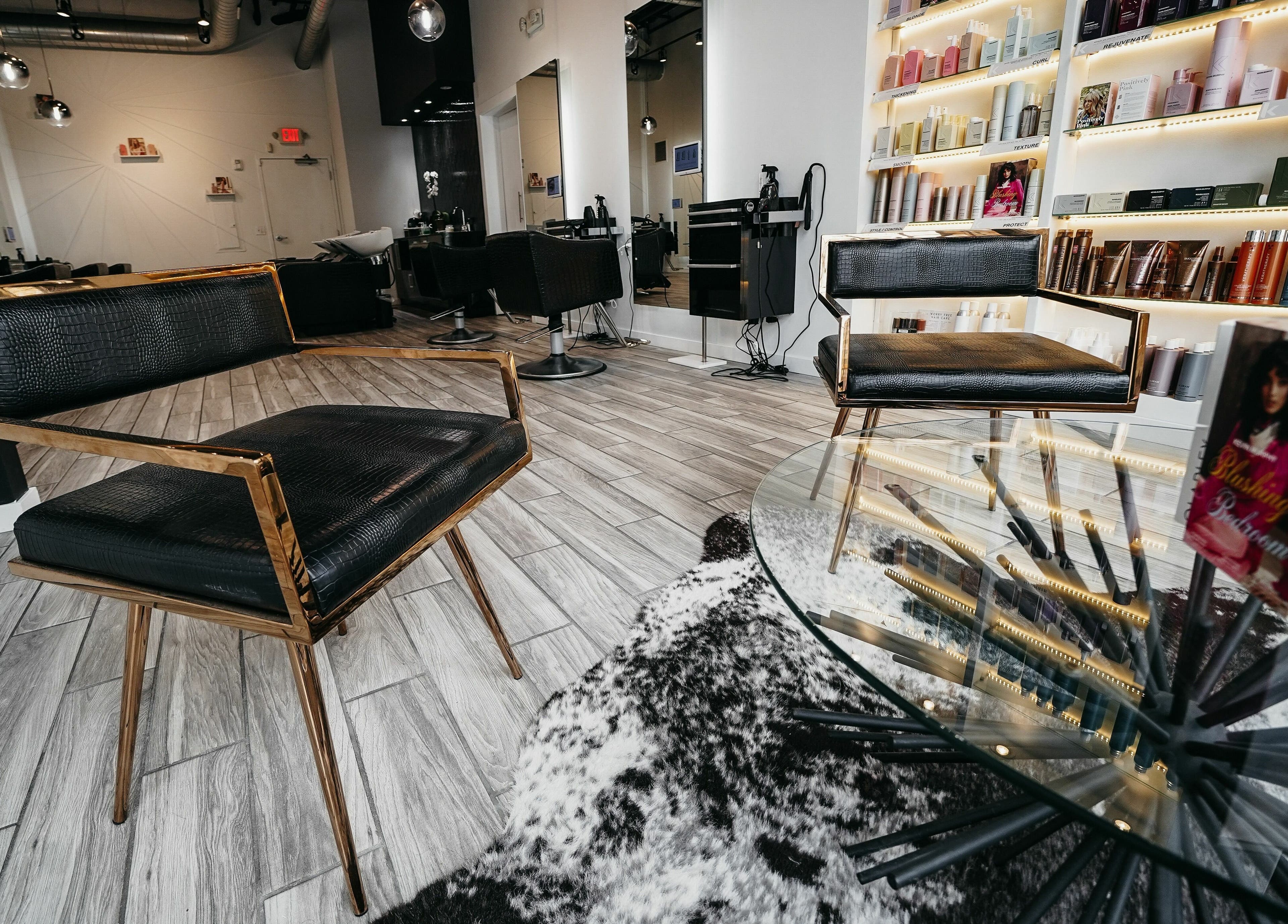 Elegant interior of Salon Blānc in Milwaukee, Wisconsin, US with stylish chairs and beauty products.
