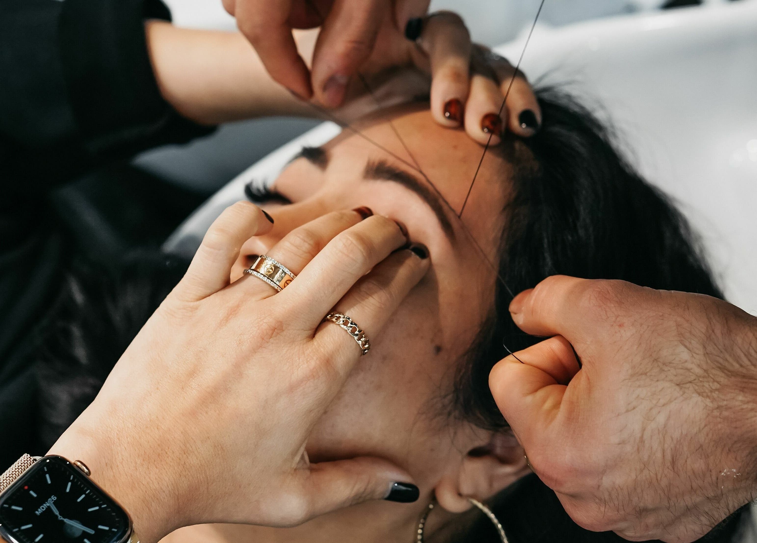 Expert eyebrow threading at Salon Blānc, Milwaukee, Wisconsin, US, offers precise and beautiful brow shaping.