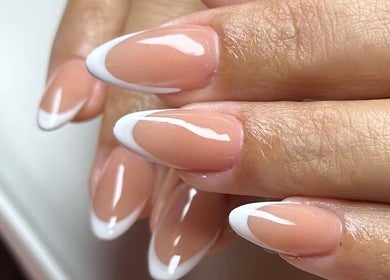 Beautiful French manicure at Gris Beauty Spa, Orlando, Florida, US, showcasing elegant nail art design.