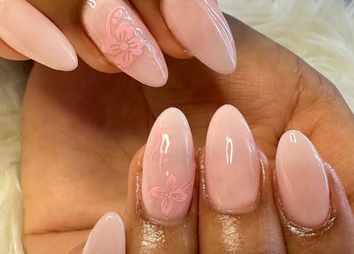 Styled pink nails with floral design at Gris Beauty Spa in Orlando, Florida, US.