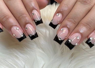 Elegant black-tipped nails with rhinestones at Gris Beauty Spa, Orlando, Florida, US.