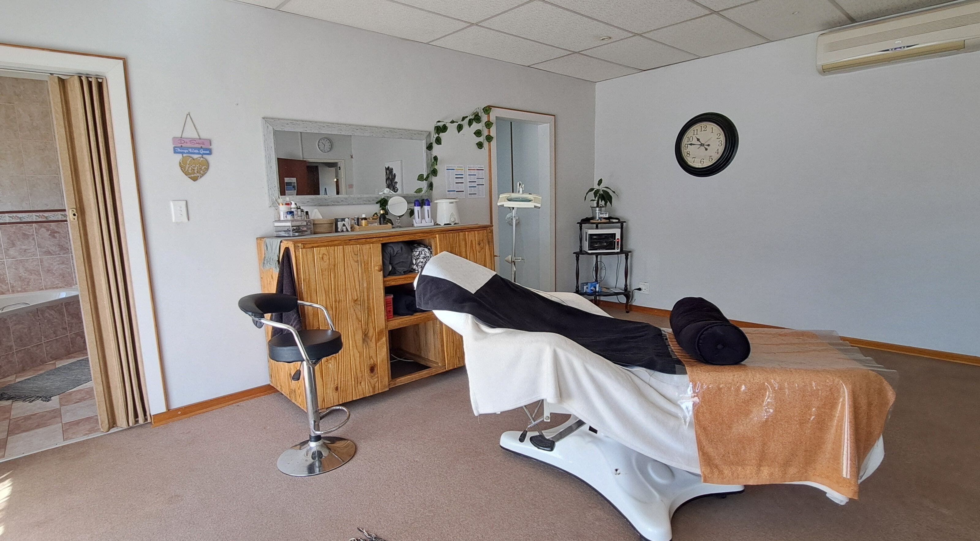 Relaxing treatment room at Time Out Lia’s Beauty Studio in Orkney, North West, ZA featuring modern decor.