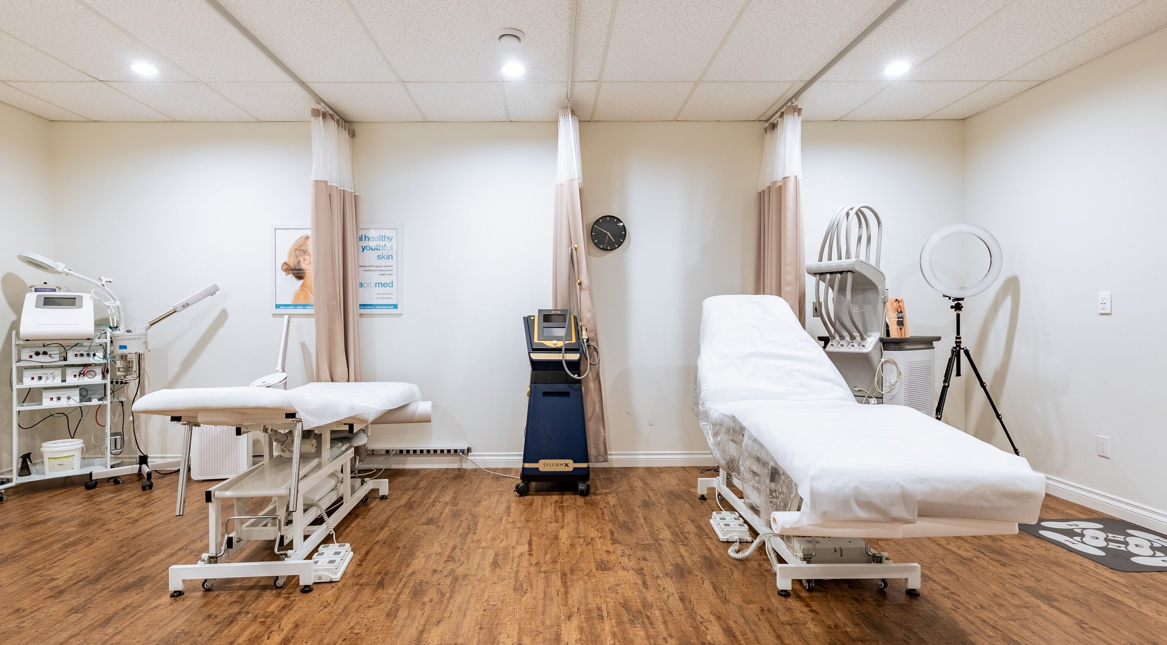 Modern treatment room at Breeze Laser MedSpa, Abbotsford, British Columbia, CA, with advanced equipment and beds.