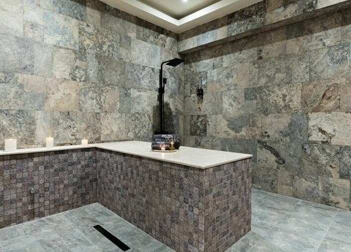 Elegant stone room at Prive Spa in دبي, دبي, AE, featuring tranquil ambiance and soft candlelight.