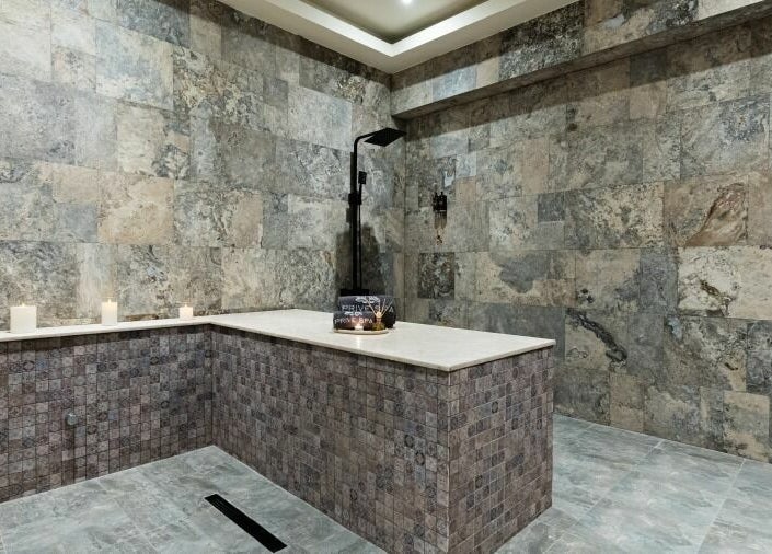 Elegant stone room at Prive Spa in دبي, دبي, AE, featuring tranquil ambiance and soft candlelight.