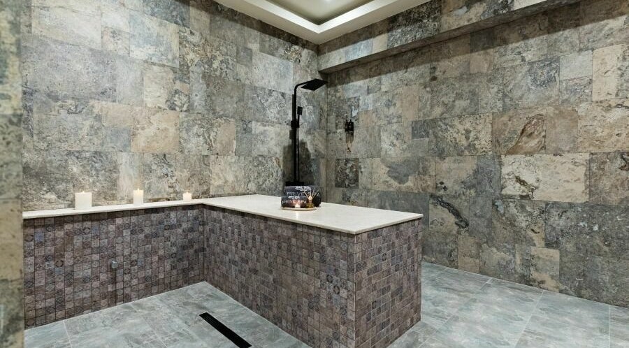 Elegant stone room at Prive Spa in دبي, دبي, AE, featuring tranquil ambiance and soft candlelight.