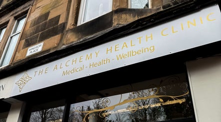 Entrance of The Alchemy Clinic Bridge of Weir in Scotland, GB showing its shopfront and signage.