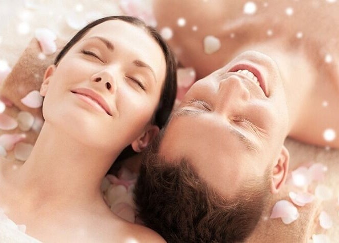 Couple relaxing with rose petals at Relax Spa, Allen, Texas, US. Experience peace and rejuvenation.