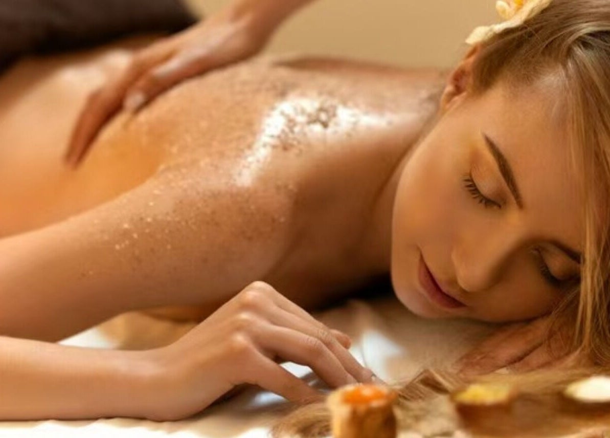A woman enjoying a relaxing back massage at Relax Spa, Allen, Texas, US.