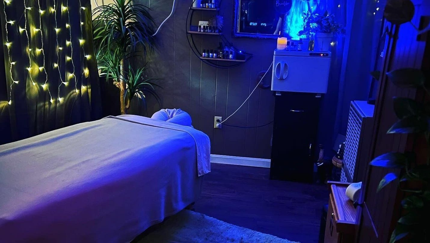 Relaxing massage room at Now and Zen Wellness LLC, Throop, Pennsylvania, US with calming lighting and decor.