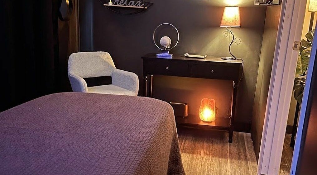 Cozy wellness room at Now and Zen Wellness LLC in Throop, Pennsylvania, US with warm lighting and relaxing decor.