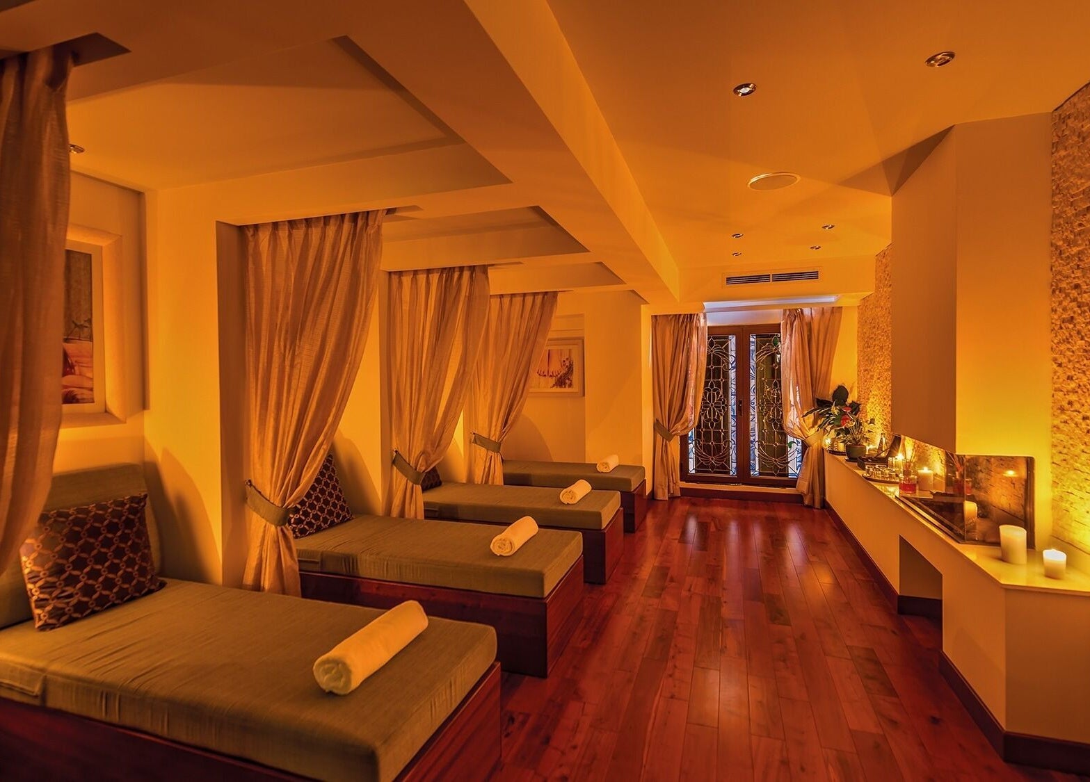 Luxurious relaxation area at The Grand Hotel Elemis Spa, Gozo, MT with soft lighting and elegant decor.