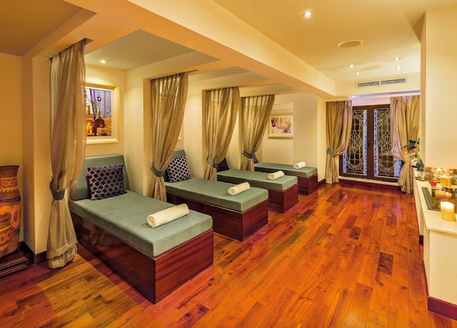 Luxurious relaxation room at The Grand Hotel Elemis Spa, Gozo, MT with elegant decor and plush seating.