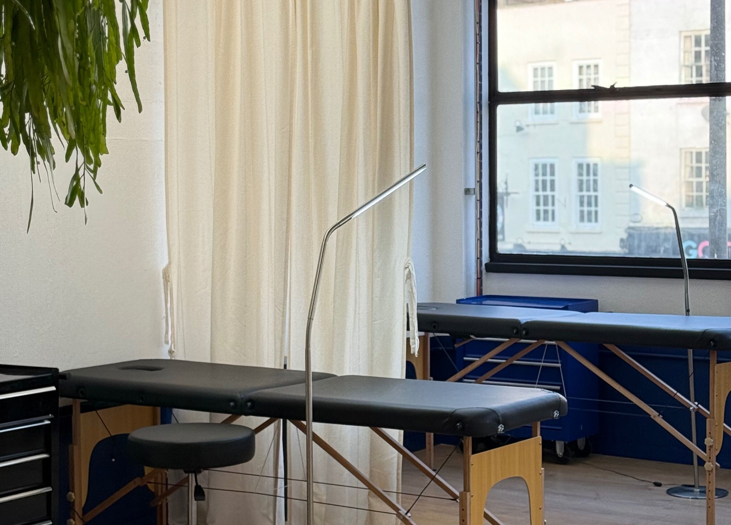 Relaxing spa room at CRISP BRISTOL, Bristol, England, GB with massage tables and calming decor.