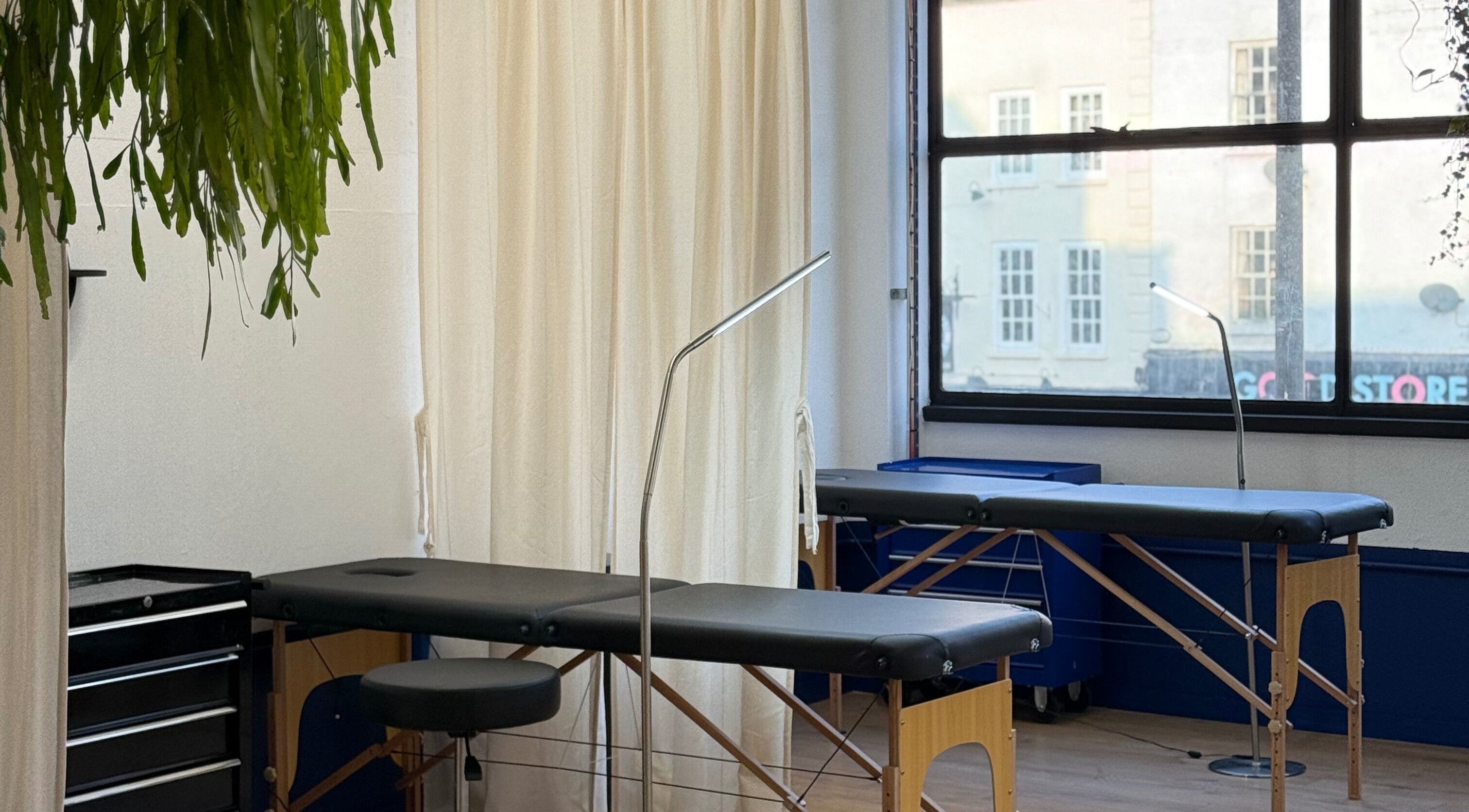 Relaxing spa room at CRISP BRISTOL, Bristol, England, GB with massage tables and calming decor.