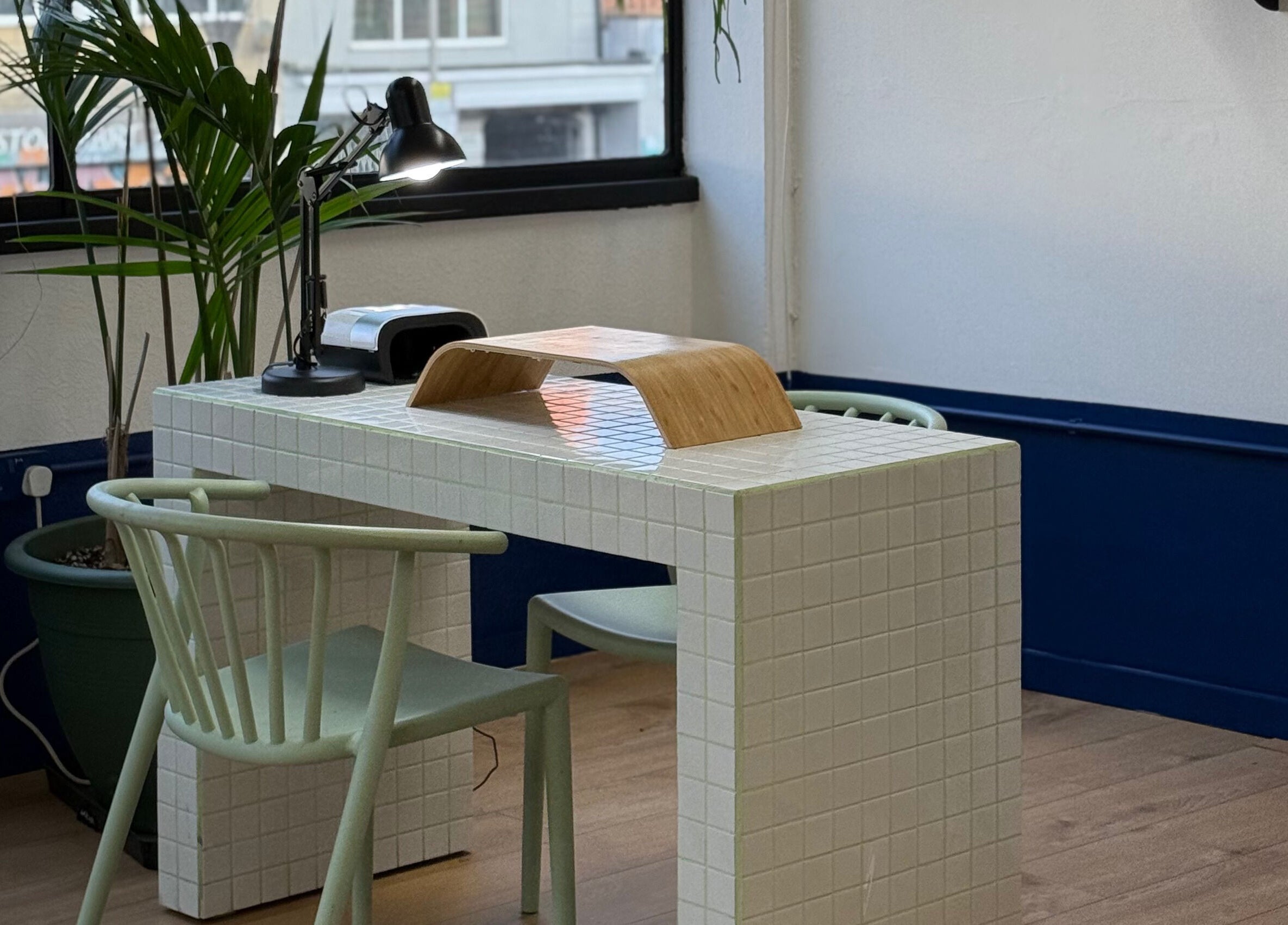 Modern nail station at CRISP BRISTOL, Bristol, England, GB with stylish decor and ample lighting.