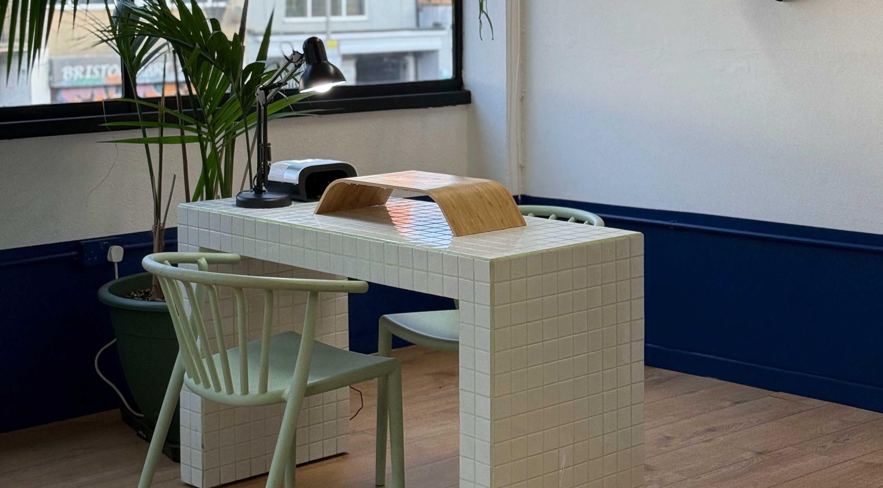 Modern nail station at CRISP BRISTOL, Bristol, England, GB with stylish decor and ample lighting.