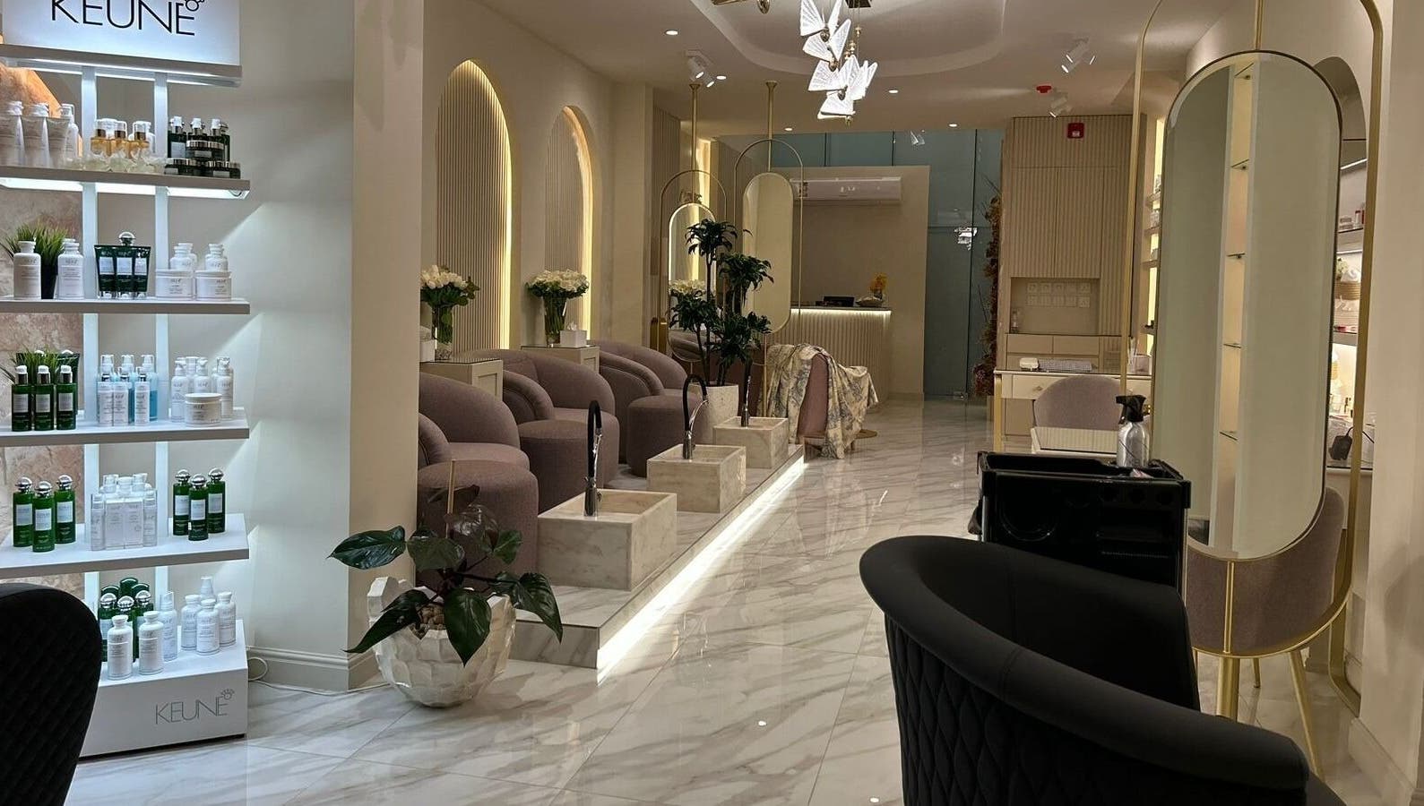 Luxurious interior of Gabriella Salon, Al Khobar, Eastern Province, SA featuring chic seating and product displays.