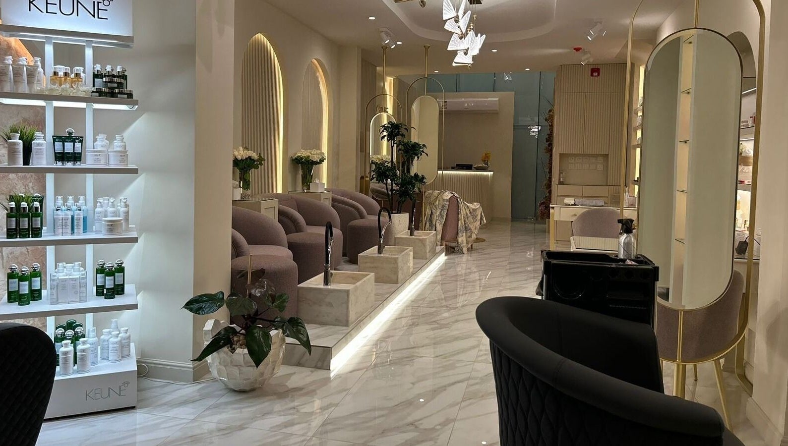 Luxurious interior of Gabriella Salon, Al Khobar, Eastern Province, SA featuring chic seating and product displays.