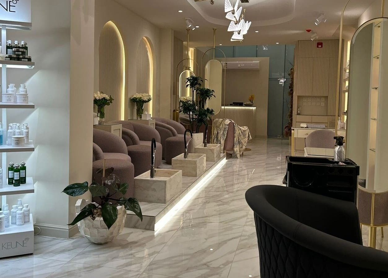 Luxurious interior of Gabriella Salon, Al Khobar, Eastern Province, SA featuring chic seating and product displays.