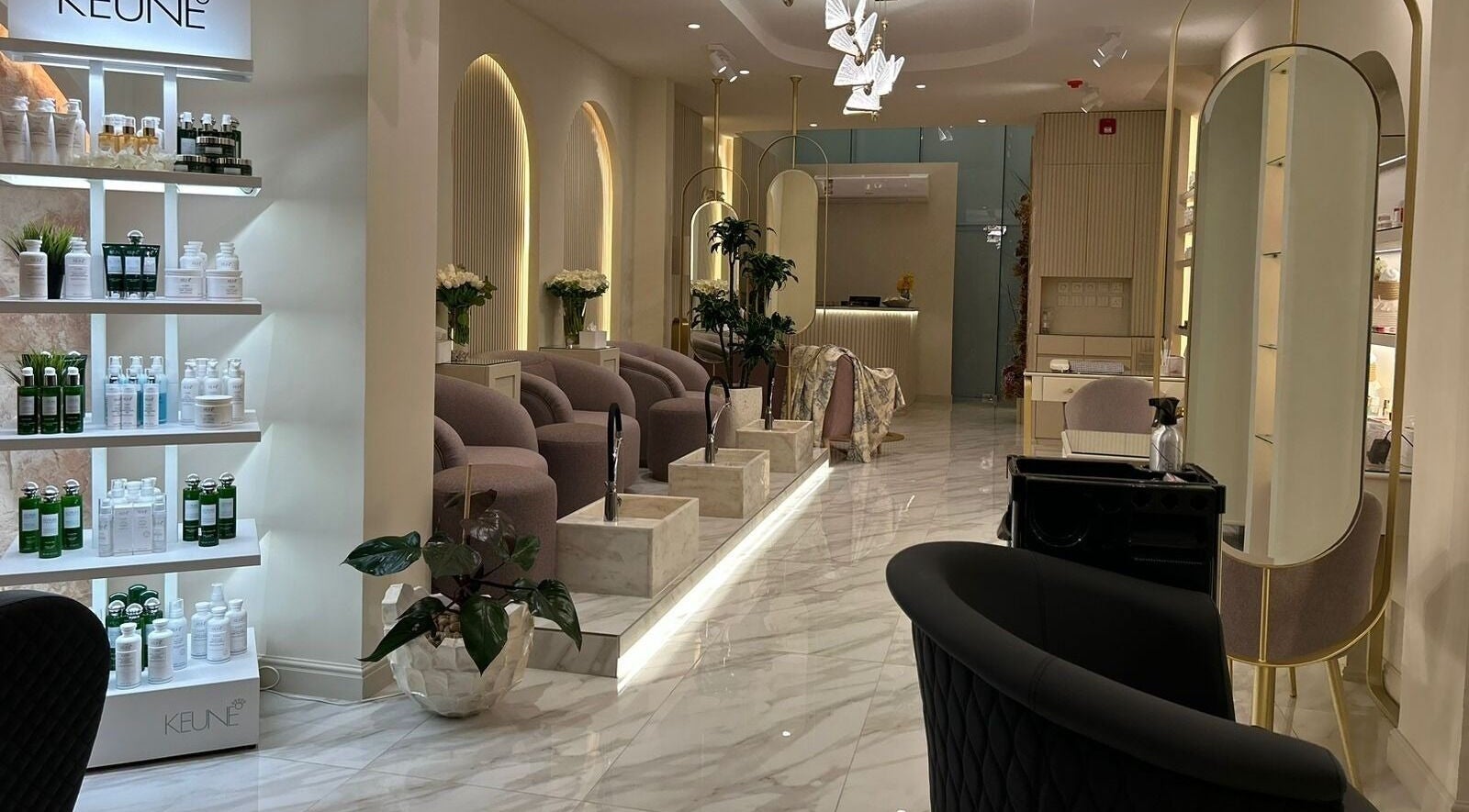 Luxurious interior of Gabriella Salon, Al Khobar, Eastern Province, SA featuring chic seating and product displays.