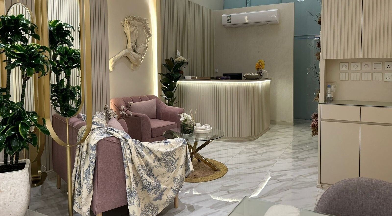 Modern reception area at Gabriella Salon, Al Khobar, Eastern Province, SA with chic decor and comfortable seating.