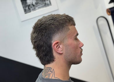 Profile of a stylish mullet haircut at Syndicat Barber, Melbourne, Victoria, AU.