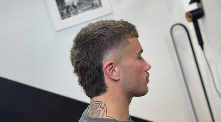 Profile of a stylish mullet haircut at Syndicat Barber, Melbourne, Victoria, AU.