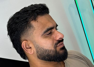 A stylish beard trim at Syndicat Barber, Melbourne, Victoria, AU showcasing expert grooming.