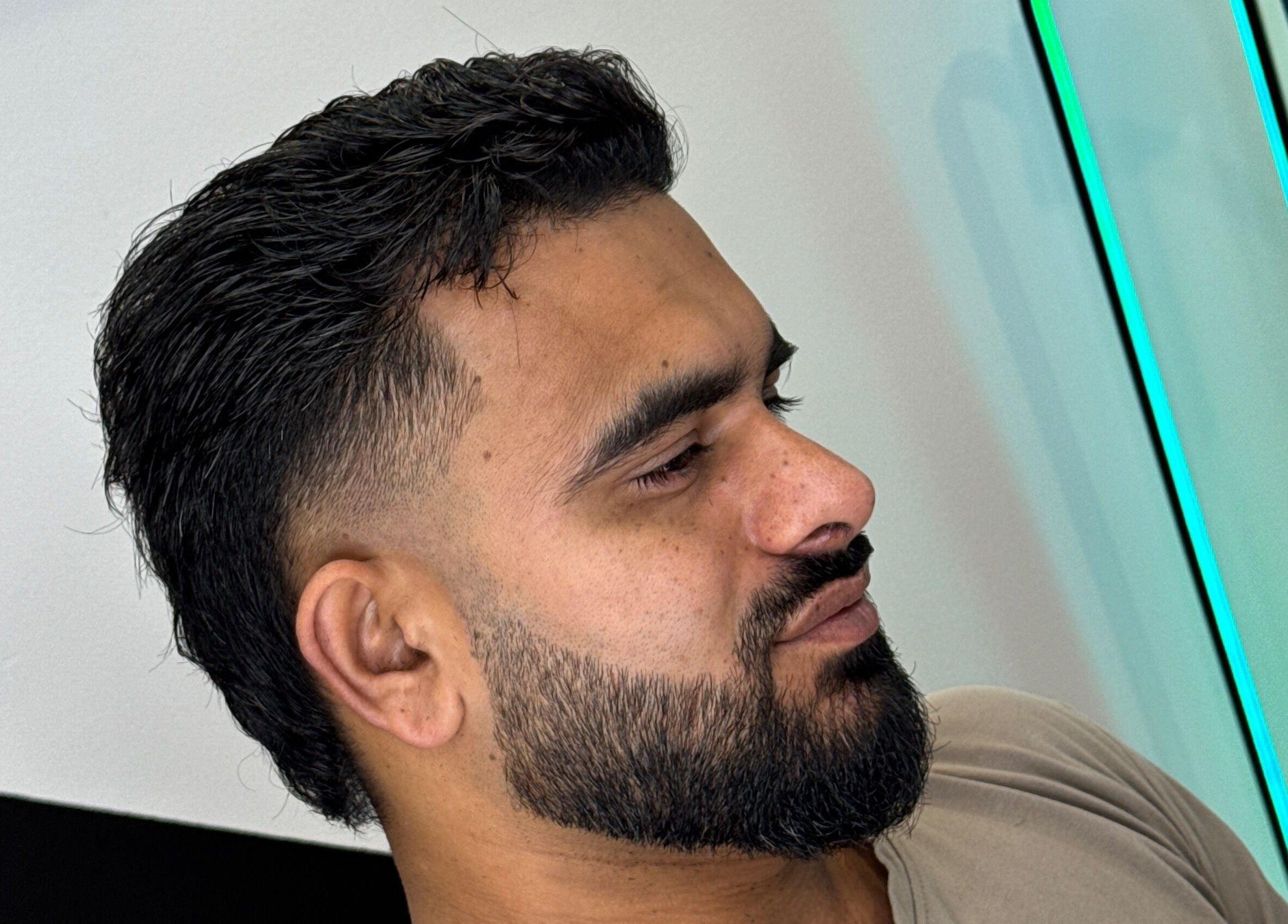 Close-up of a modern haircut with a fade at Syndicat Barber, Melbourne, Victoria, AU.