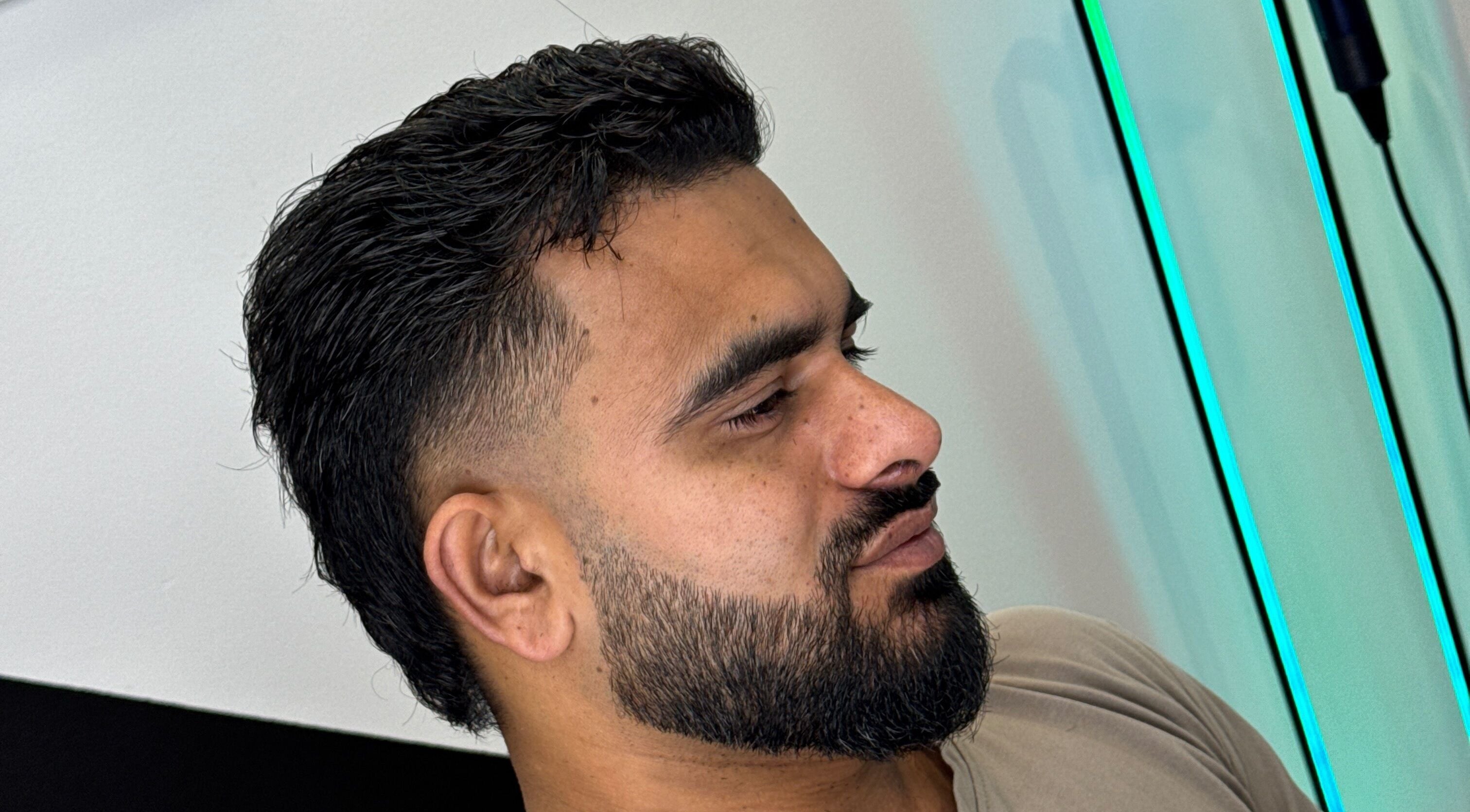 Close-up of a modern haircut with a fade at Syndicat Barber, Melbourne, Victoria, AU.