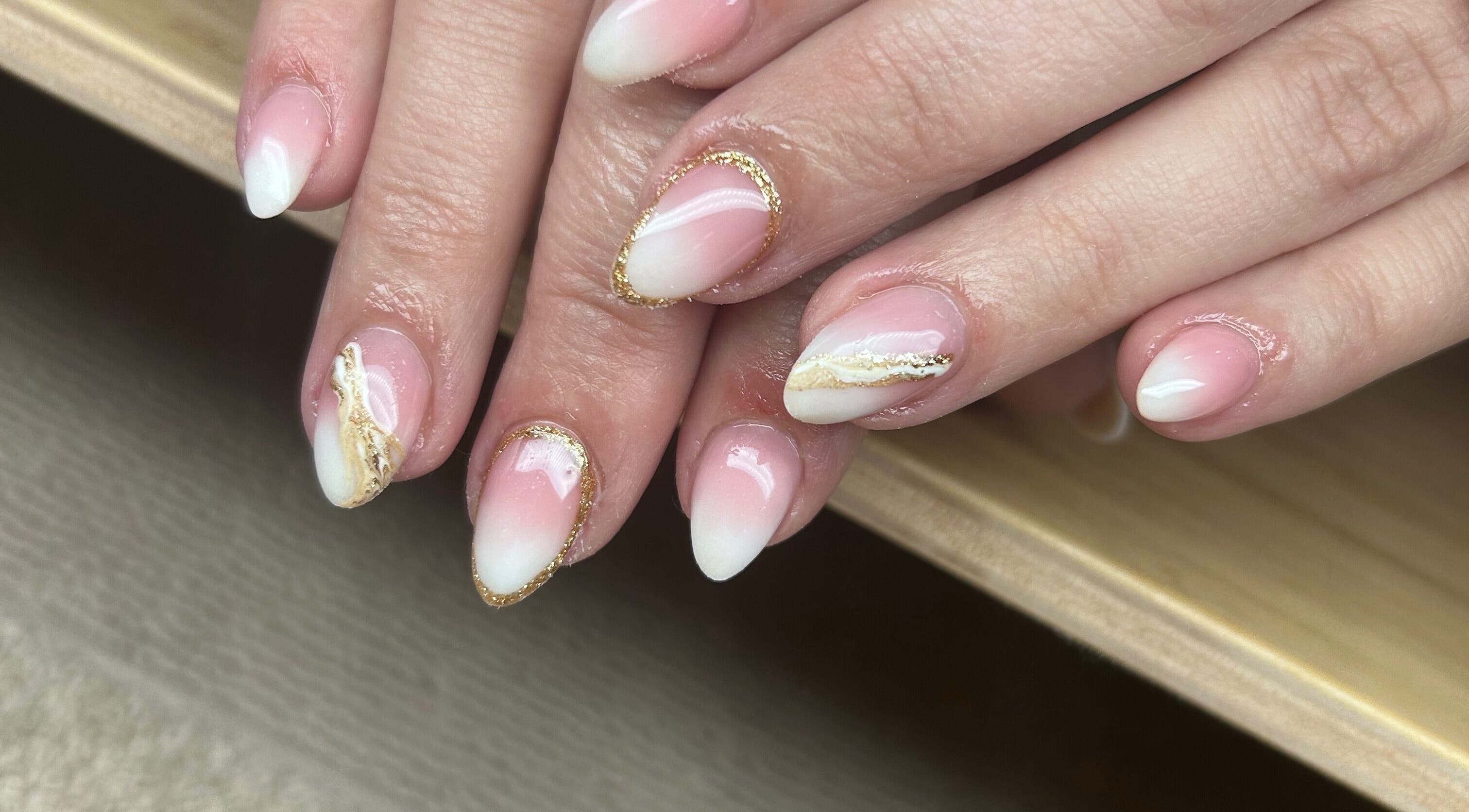 Elegant pink and white nail art at Nails By Jade, Canvey Island, England, GB. Features gold accents.