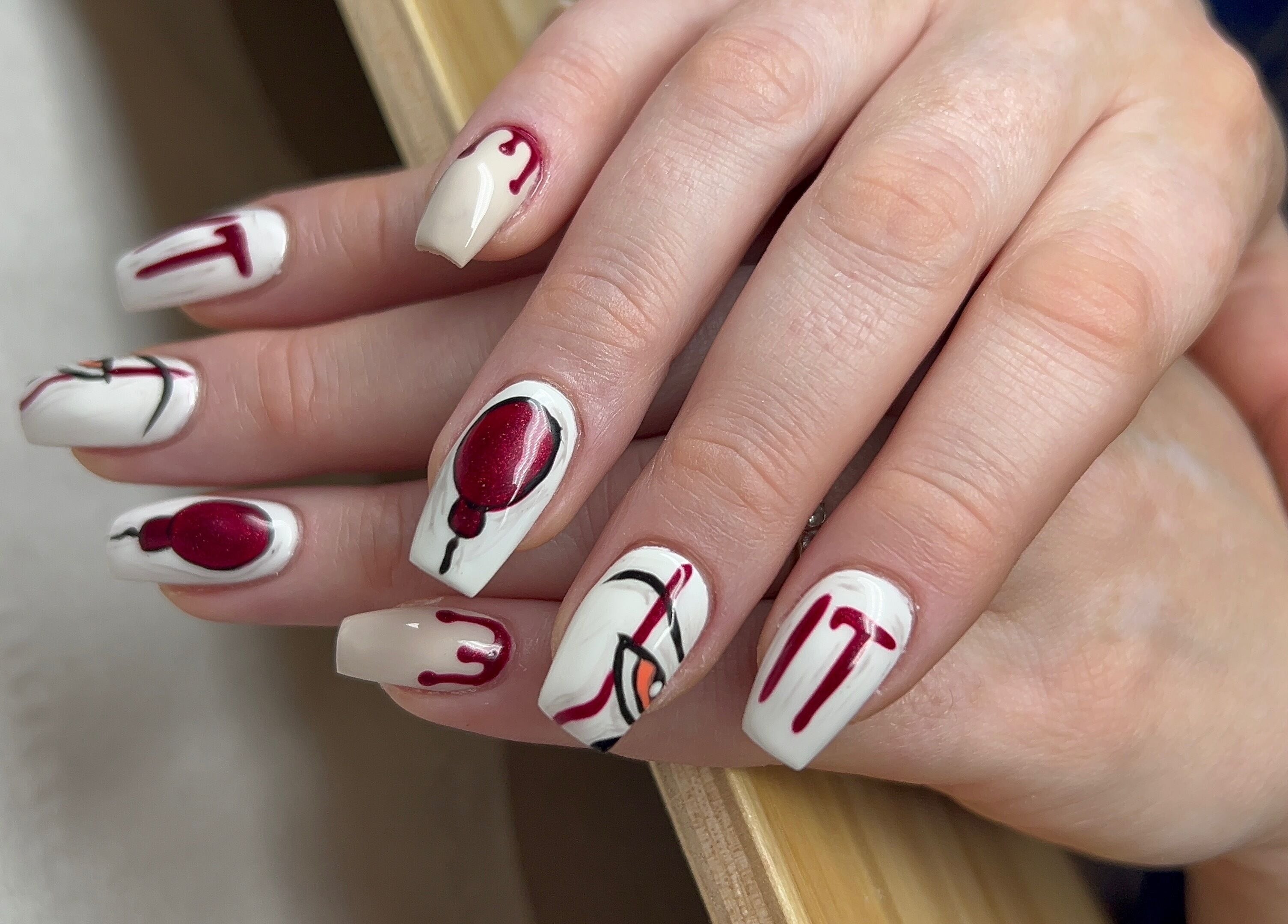 Elegant nail art with red and white design at Nails By Jade, Canvey Island, England, GB.