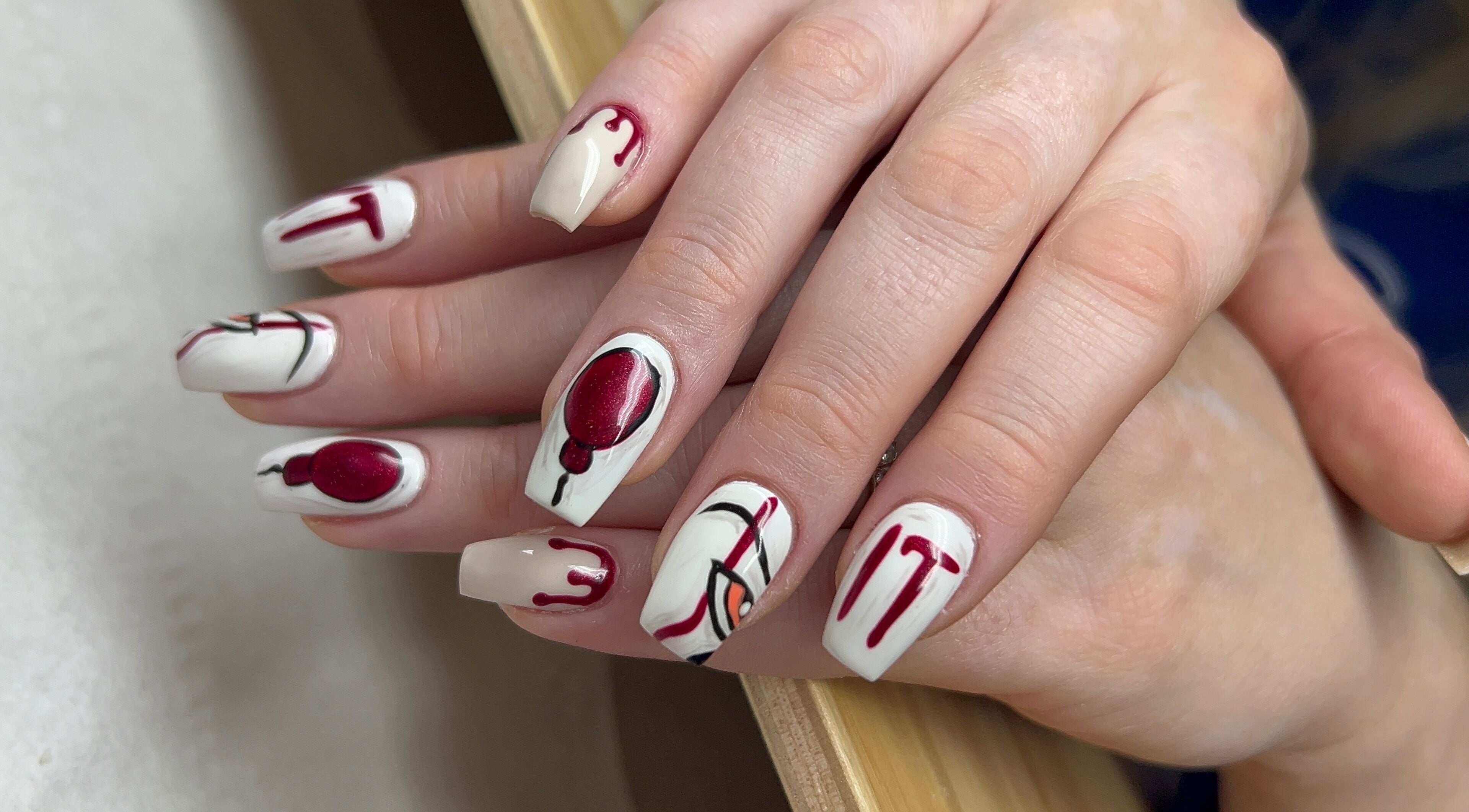 Elegant nail art with red and white design at Nails By Jade, Canvey Island, England, GB.