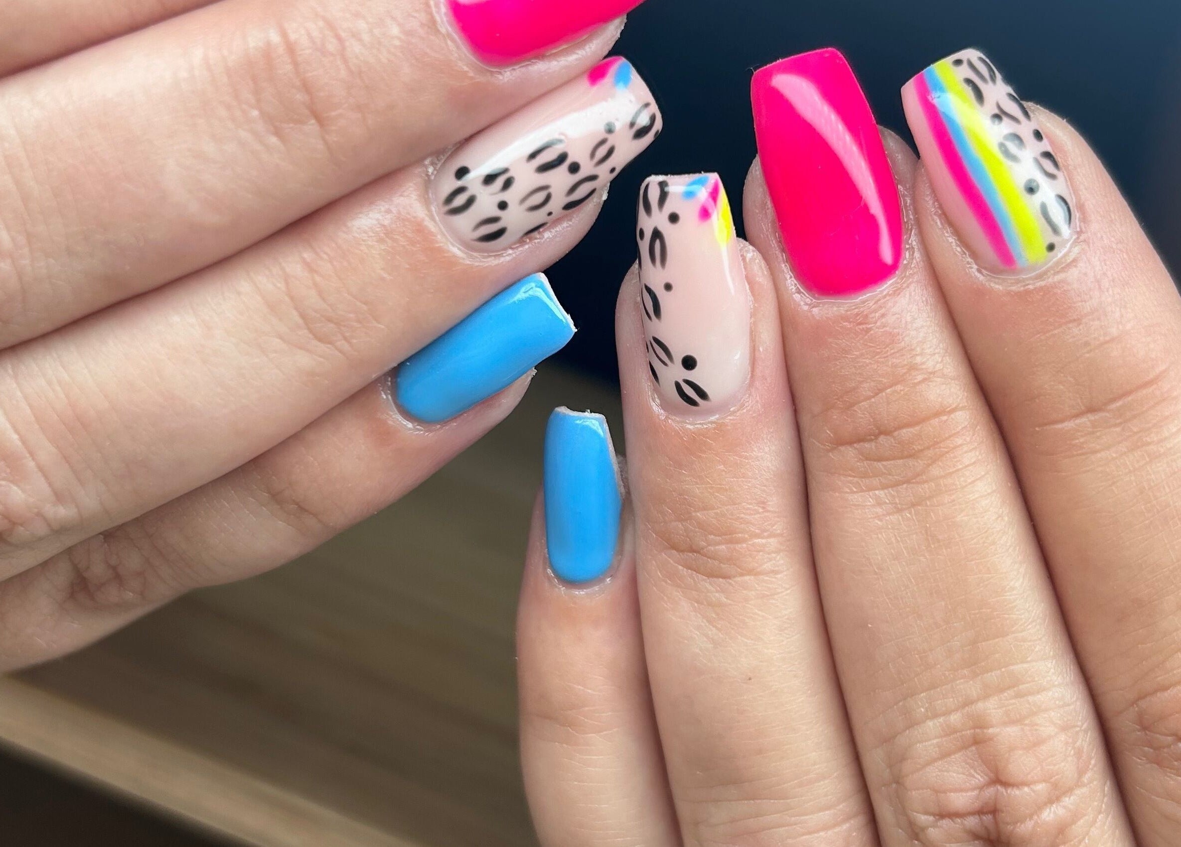 Stylish multicolored nails with leopard patterns at Nails By Jade, Canvey Island, England, GB.