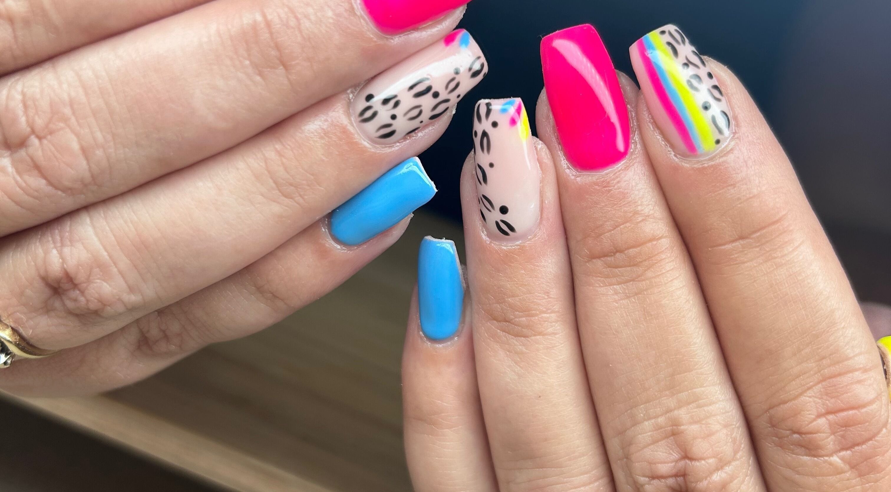 Stylish multicolored nails with leopard patterns at Nails By Jade, Canvey Island, England, GB.
