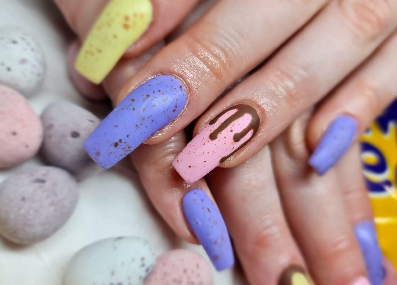 Colorful speckled nail art inspired by chocolate eggs at Nails By Jade, Canvey Island, England, GB.