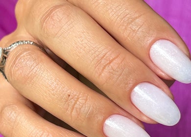 Elegant white manicure at Natalia Calkam Beauty Studio in Newbury, England, GB. Perfectly polished nails.