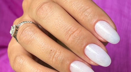Elegant white manicure at Natalia Calkam Beauty Studio in Newbury, England, GB. Perfectly polished nails.