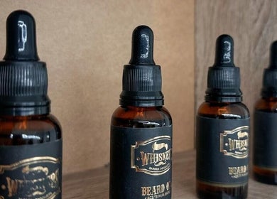 Line of premium beard oils at Quinche Studio, Mascot, New South Wales, AU, on a rustic wooden shelf.