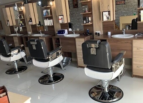Modern barber chairs at Barber Tina at JJ's Barber Shop, Naxxar, MT for premium grooming services.